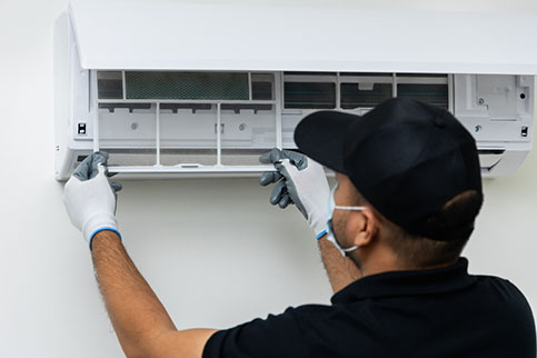 HVAC tech performing ac maintenance in weatherford tx